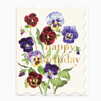 Viola birthday card with a bouquet of colourful purple, red and yellow pansies on a cream background with scalloped edges.