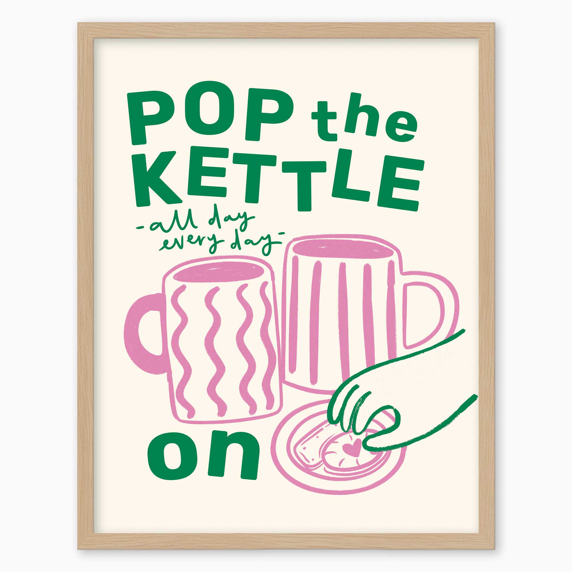 Pop the Kettle Pink framed print featuring green text, two pink mugs, and a biscuit on a light cream background.