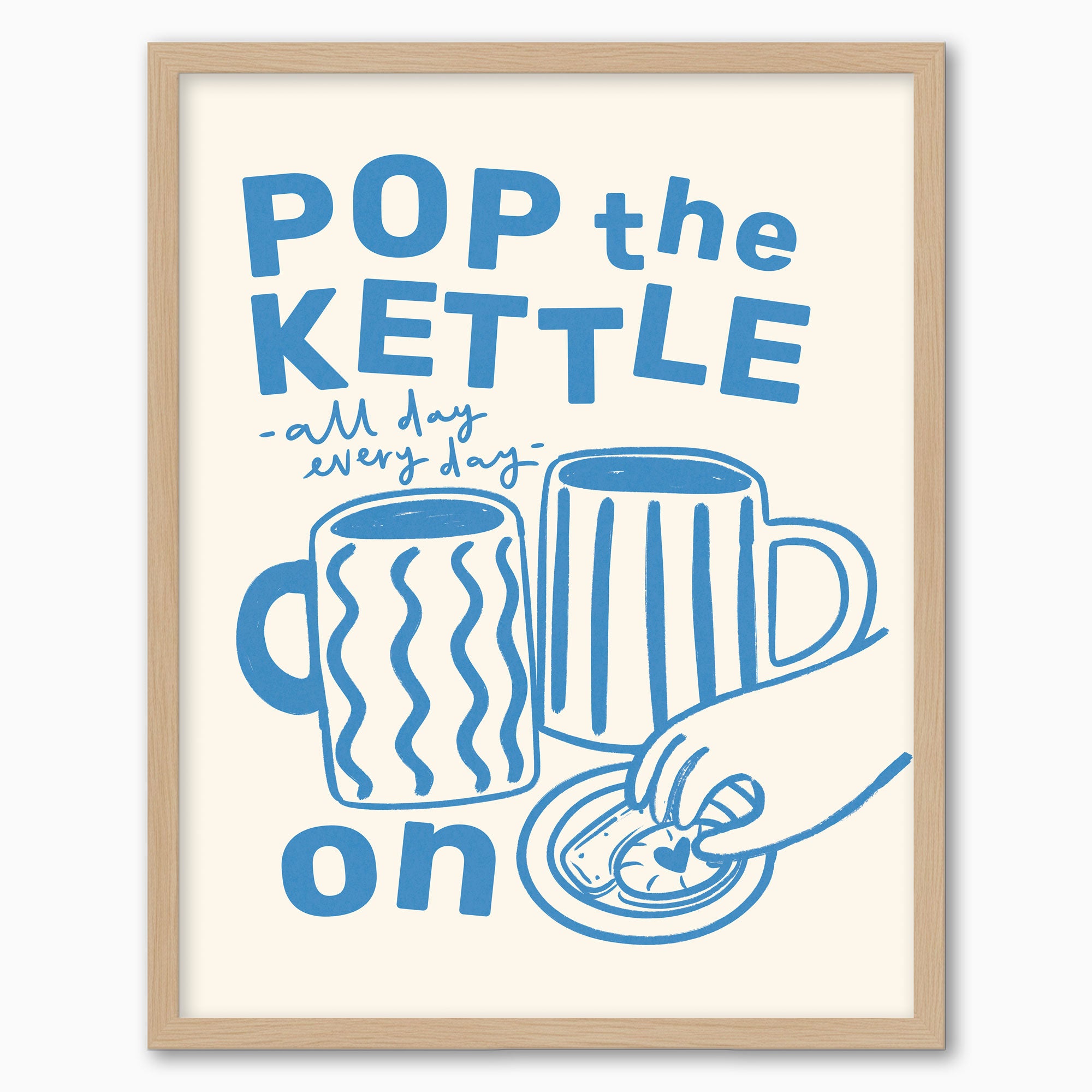 Pop the Kettle Blue framed print featuring blue illustrations of mugs and a hand with a biscuit in a light wood frame.
