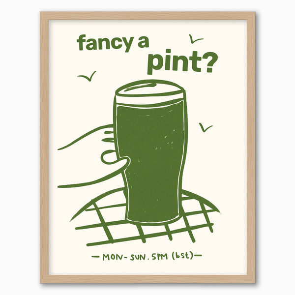 Fancy a Pint? framed print featuring a green illustration of a hand holding a pint glass on a light cream background.