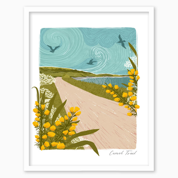 Camel Trail Lino print in a white frame featuring a coastal path, swirling blue sky, birds, and yellow gorse flowers.