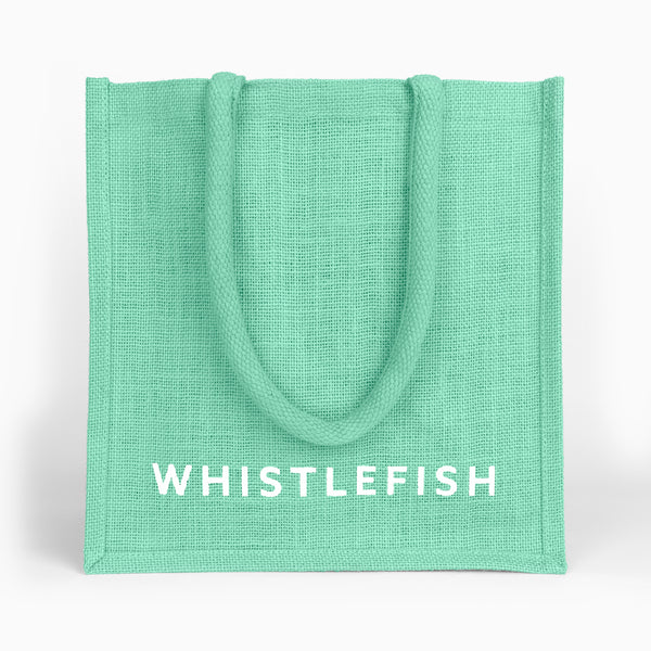 Small mint green jute bag with sturdy rope handles and white branding on the front.