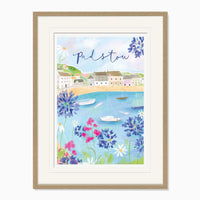 Padstow Large Framed Print featuring a coastal harbour scene with colourful flowers, boats, and a light wood frame.