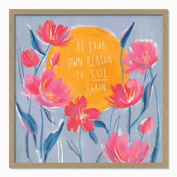 Rise Again framed print featuring pink flowers and a large yellow sun with the text Be Your Own Reason To Rise Again.