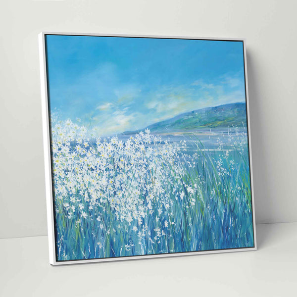 Under A Summer Sun framed canvas featuring white daisies in a blue landscape with a distant hill under a bright sky.