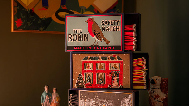 Three Large Matchboxes Stacked On Top One Another