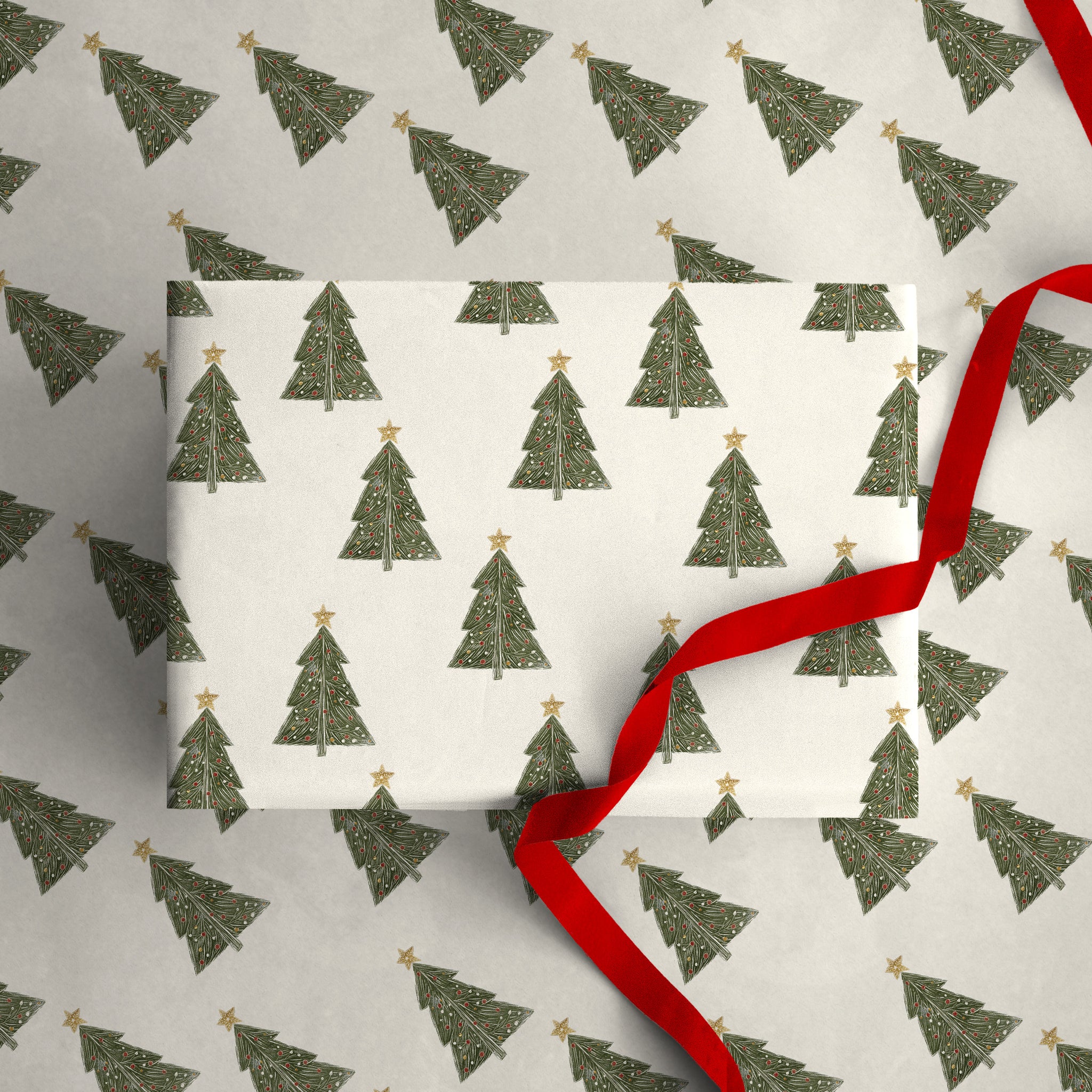 Lino Forest Christmas wrapping paper featuring green tree illustrations with gold stars and a red ribbon.