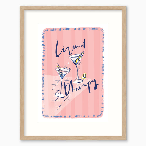 Liquid Therapy pink framed print featuring two martini glasses and blue text on a striped pink background.