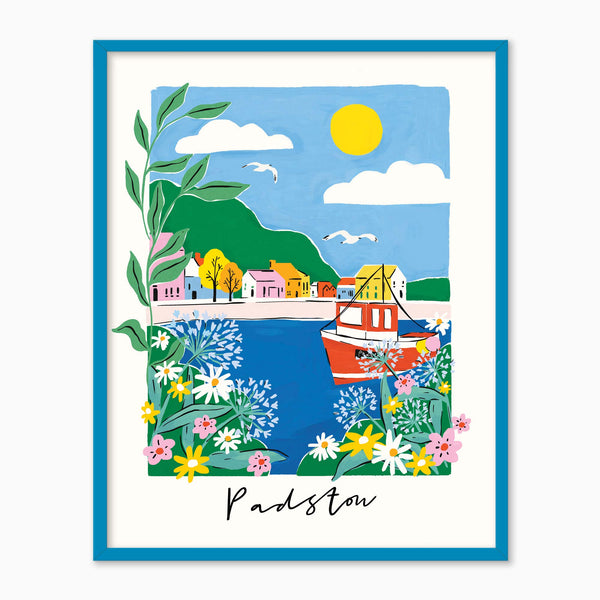 Padstow Brights framed print featuring a colourful harbour scene with a red boat, vibrant flowers, and a blue frame.