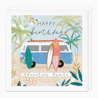 Adventure Awaits birthday card featuring a blue campervan, surfboards, and palm trees on a sandy beach.