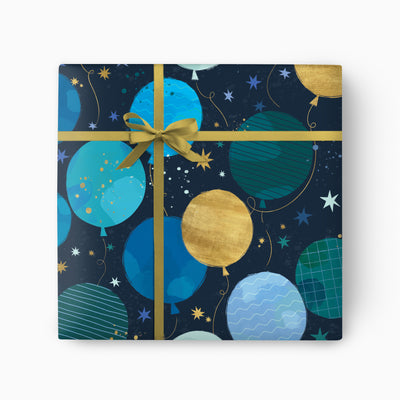 Blue Balloon Wrapping Paper featuring blue and gold balloons, stars, and a gold ribbon tied in a bow on a dark background.