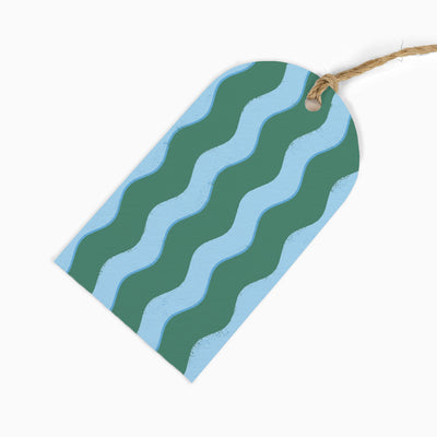 Green Wibbly Stripes gift tag featuring alternating wavy lines in dark green and light blue with a natural twine tie.