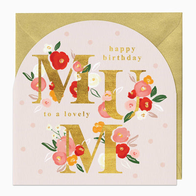 Lovely Mum birthday arch card with gold lettering, floral illustrations, and a gold envelope on a pale pink polka dot background.