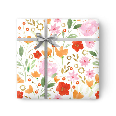 Mixed Floral Red Wrapping Paper featuring a watercolour pattern of red, pink, and orange flowers with a grey ribbon bow.