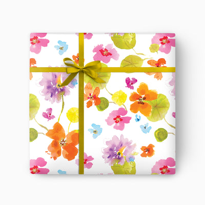 Nasturtium wrapping paper featuring a colourful watercolour floral pattern tied with a vibrant yellow ribbon.