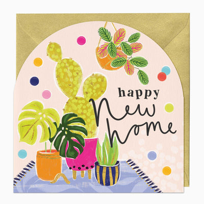 Neon New Home arch greeting card featuring potted cacti and house plants against a pale pink background with gold envelope.