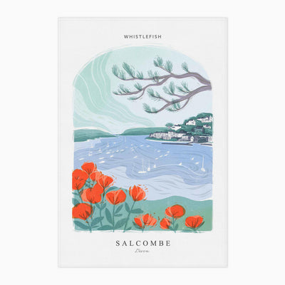 Salcombe Arched Lino tea towel featuring a coastal scene with red flowers, blue water, boats and a pine branch.