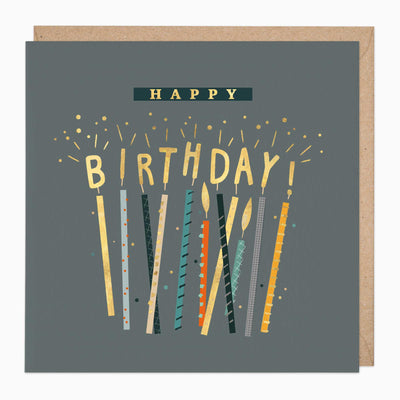 Sparkling Candles Birthday Card on a grey background with colourful patterned candles and gold lettering, with a brown envelope.