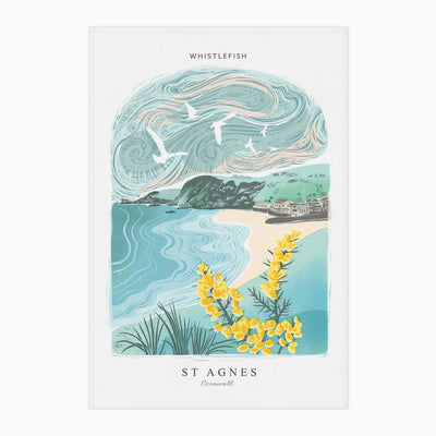 St Agnes Arched Lino tea towel featuring a coastal scene with yellow gorse, blue sea, and a swirling sky.