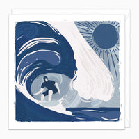 Surfer Lino Art Card featuring a blue-toned lino print illustration of a surfer riding a large wave under a bright sun.